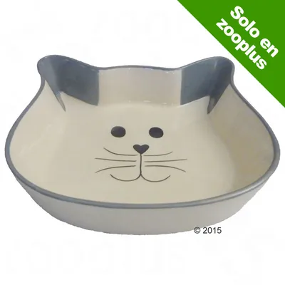 Comedero de cerámica en forma de cabeza de gato con dibujo de cara de gato. Texto visible: Solo en zooplus.