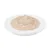 Close-up of beige wet food portion on white plate, showing product consistency.
