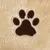Beige plush material with brown paw embroidery, suitable for pet accessories or decoration.