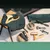 kooa. Care accessories for pets: wooden brushes, scissors, trimmers, combs and towels with kooa logo.
