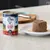 Ziwi Peak New Zealand Venison Recipe natvoer voor honden. Blik van 390g en geserveerd voer op een bord. 91% vlees, organen en schelpdieren, zonder kunstmatige toevoegingen.