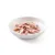 Morceaux de viande rose et blanche dans une assiette blanche, présentés sans emballage ni marque visible.
