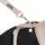 Nomad Tales hundesnor med guldfarvet karabinhage og beige-mønstret design, fastgjort til en matchende hundesele.