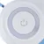 Bouton marche/arrêt, symbole d’alimentation visible au centre d’un cercle blanc et gris clair.
