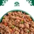 Bowl filled with wet pet food containing visible chunks of meat, peas, carrots and rice.