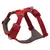 Red dog harness with adjustable straps, padded inner material and metal ring for attachment. Suitable for secure hold and comfort.
