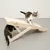 Wooden scratching ramp with sisal surface, brand Natural Paradise. Two cats demonstrate use: one on top of the ramp, the other underneath.
