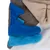 Fleece blankets in various colours: beige, blue, light blue and white, stacked on top of each other.