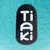 Tiaki. Marka produktów dla zwierząt, biały napis na czarnym tle.