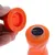 Orange legetøj af plast med aftageligt låg, synlig USB-opladningsport og tænd/sluk-knap.