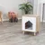 Wooden pet furniture with white front and house-shaped entrance, padded interior surface. Modern design on four legs, suitable for indoor use.