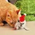 Plush mouse with red Christmas hat, suitable as cat toy. Shown next to an orange cat and green decoration.