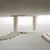 Ceiling-mounted scratching post with sisal-wrapped columns, wooden platforms and padded lying areas.
