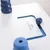 Jeu interactif blanc et bleu avec texte visible « DOG Activity » sur une plaque coulissante, éléments en plastique visibles.