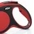 Guinzaglio avvolgibile Flexi, manico ergonomico nero e rosso con pulsante di blocco visibile. Marchio Flexi ben leggibile sul lato.