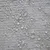 Gros plan sur tissu beige avec gouttes d’eau visibles à la surface. Le matériau et la couleur sont clairement observables.