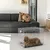 Wire pet crate shown in a living room with a small brown animal lying inside, demonstrating indoor use and size of the crate.