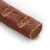 Stick marrone per pet, consistenza morbida e superficie liscia con incisioni visibili. Nessun marchio o testo presente sull'articolo.