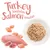 Turkey Temptation, Salmon Sensation. Shown: raw turkey meat, salmon pieces and shredded food on a plate.