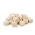 White, cube-shaped snacks made from freeze-dried meat, visibly arranged loosely.