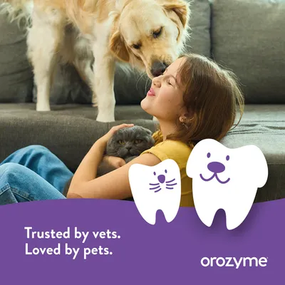 Girl with dog and cat on sofa, Text: Trusted by vets. Loved by pets. orozymes. Girl with dog and cat on sofa, Text: Trusted by vets. Loved by pets. orozymes.
