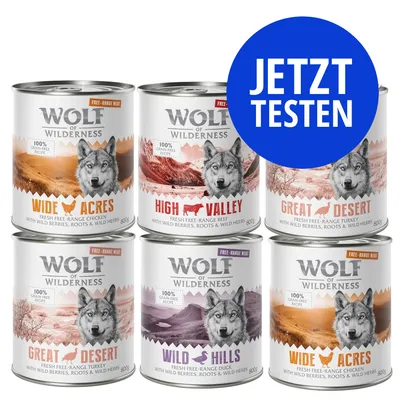 Sechs Dosen Wolf of Wilderness: Wide Acres, High Valley, Great Desert, Wild Hills. Aufschrift: 100% grain free recipe, jetzt testen.