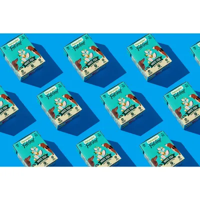 Multiple boxes labelled 'Feel Good White Fish' with images of fish and vegetables, arranged in a repeating pattern on a blue background.