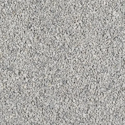 Zbliżenie na szare, drobne granulki żwirku; widoczna struktura i rozmiar ziaren. Materiał: kamień lub minerał.