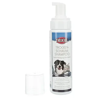 Flacone di shampoo secco a schiuma Trixie, testo visibile: 'Trockenschaum-Shampoo', immagini di cane e gatto sull'etichetta, tappo trasparente accanto al flacone.