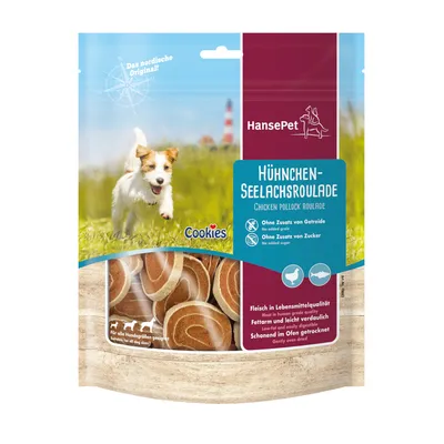 HansePet Hühnchen-Seelachsroulade. Galletas para perros visibles en el envase. Sin cereales ni azúcares añadidos. Apto para todas las razas. Texto en alemán e inglés.