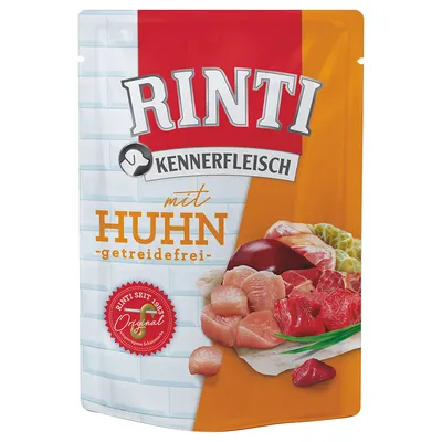 Pachet hrană pentru câini Rinti Kennerfleisch mit Huhn, getreidefrei. Imagine cu bucăți de carne și sigiliu roșu: Rinti seit 1983 Original. Text în germană vizibil pe ambalaj.