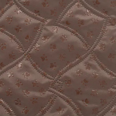 Brown, quilted material with embossed paw patterns and decorative perforations.
