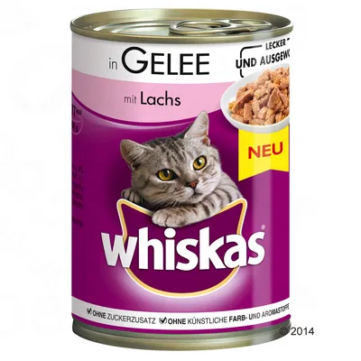 Puszka Whiskas in Gelee mit Lachs, napis NEU, bez dodatku cukru i sztucznych barwników oraz aromatów. Zdjęcie kawałków karmy w galarecie.