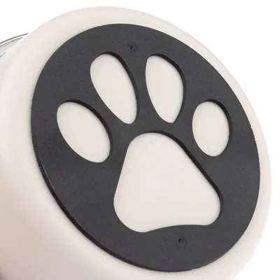 Black paw shape on white background, part of a product design.