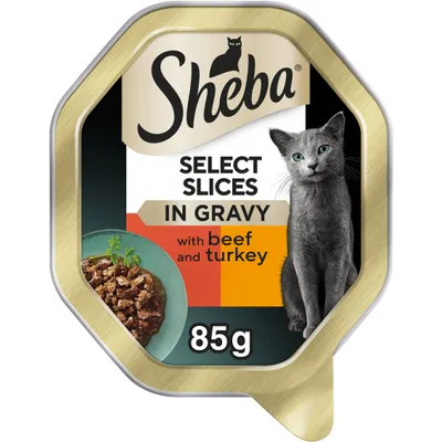 Sheba Select Slices in Gravy with beef and turkey, 85g tray. Image shows food pieces in gravy on a plate.