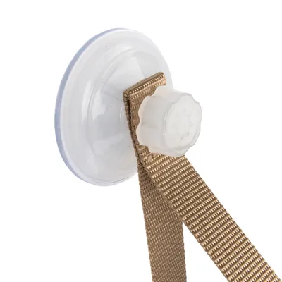 Sugpropp med beige nylonband och vit vridförslutning, lämplig för fastsättning.