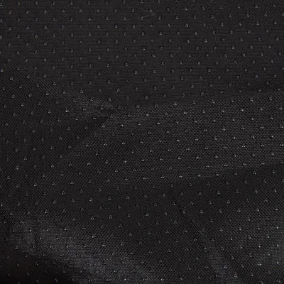 Schwarzer Stoff mit kleinen Punkten, möglicherweise rutschfestes Material.