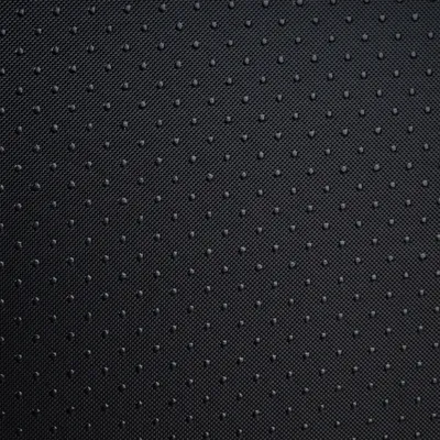 Nahaufnahme eines schwarzen, gepunkteten Textilmaterials mit rutschfester Oberfläche.