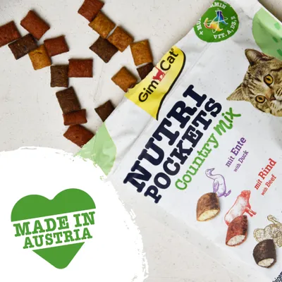 GimCat Nutri Pockets Country Mix, synliga bitar. Text på förpackning: mit Ente with Duck, mit Rind with Beef. Grönt hjärta med texten MADE IN AUSTRIA.