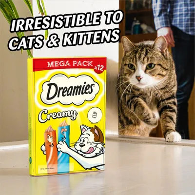 Dreamies Creamy Mega Pack x12 with text 'Irresistible to cats & kittens' and a cat approaching the product. No added sugar is shown on the packaging.