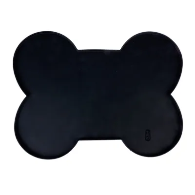 Schwarze, knochenförmige Unterlage mit Trixie-Logo in der Ecke.