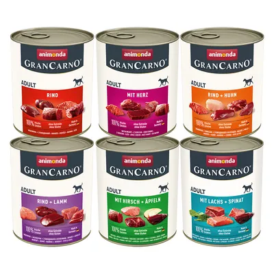 Six tins of animonda GranCarno Adult dog food, visible flavours: Rind, Mit Herz, Rind + Huhn, Rind + Lamm, Mit Hirsch + Äpfeln, Mit Lachs + Spinat. 100% frische Zutaten text shown.
