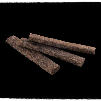 Three brown, textured stick-shaped treats displayed on a black background.