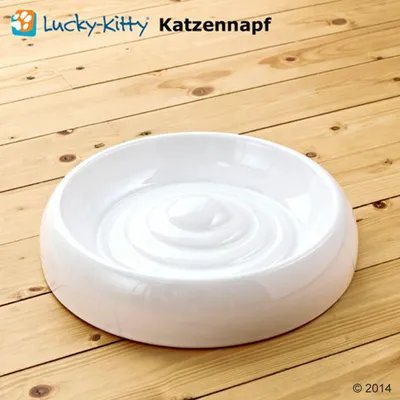 White ceramic bowl with raised inner rings, shown on a wooden surface. Text above reads 'Lucky-Kitty Katzennapf'.
