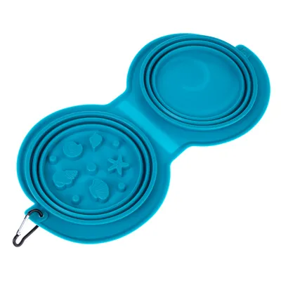 Gamelle double pliante en silicone bleu avec mousqueton, un côté décoré de motifs coquillages et étoile de mer, l’autre côté uni. Deux compartiments ronds visibles.