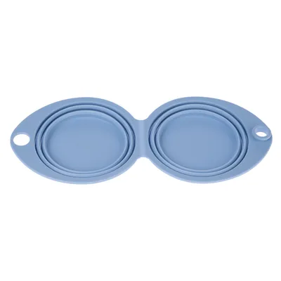 Blue foldable silicone feeding bowl with two handle openings, suitable for travel.