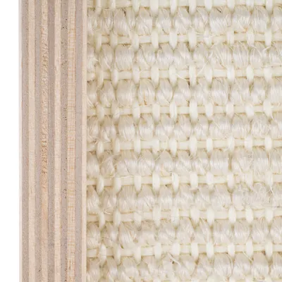 Close-up of light sisal fabric next to a wooden board, showing material texture for scratching surfaces.