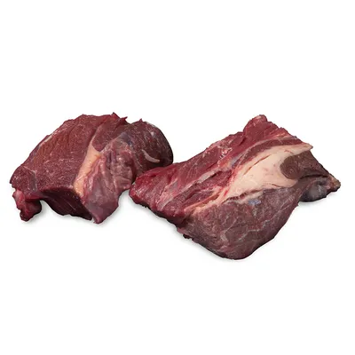 Zwei Stücke rohes Fleisch mit sichtbaren Fettanteilen, geeignet für die Darstellung von frischen Zutaten oder Rohfutter.