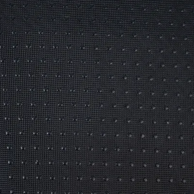 Close-up of a black, non-slip surface with small bumps for better grip.