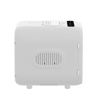 White automatic feeder with digital display and side ventilation slots.